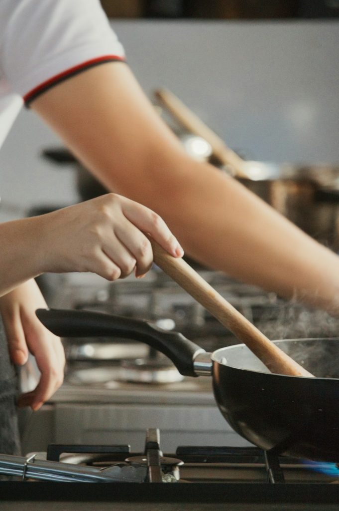 A girl cooking in a pan
